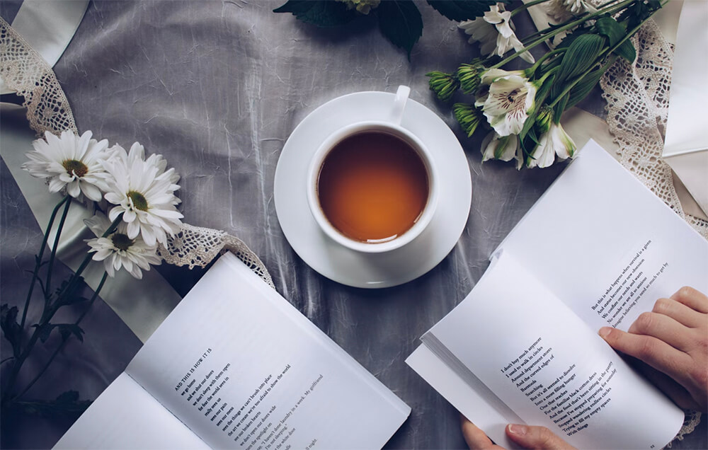 Self-Improvement Blogs (Reading a Book with Coffee Image)